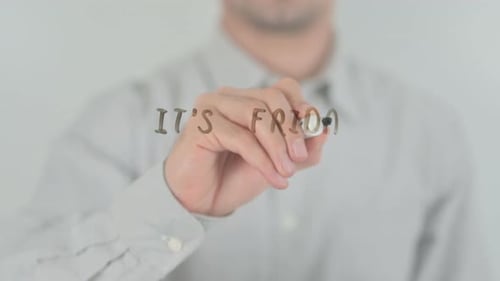 Man Writes It's Friday on a Clear Surface