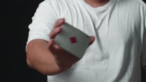 Person Displaying Playing Card Close Up