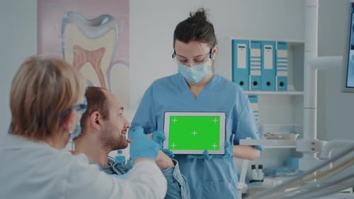 Nurse and Patient Analyzing Green Screen on Digital Tablet