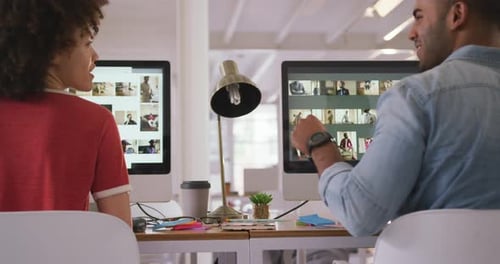 Close up view of two colleagues working in creative office