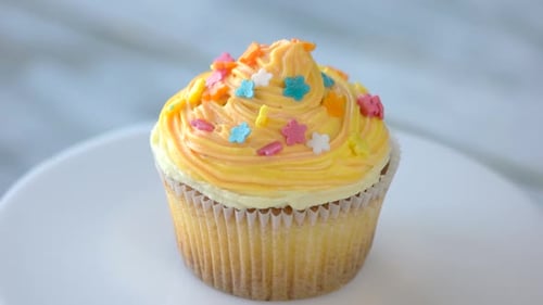Delicious Cupcake with Colorful Frosting and Sprinkles