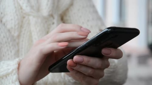 Close Up of Woman Using Smartphone