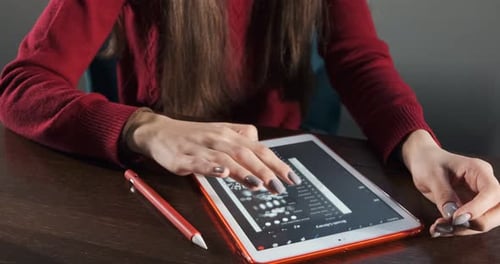 Close Up Female Designer Sitting and Working at Desk. Contemporary Young Woman Drawing and Using Pen