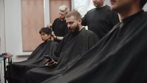 Men Getting Haircuts at Modern Barber Shop