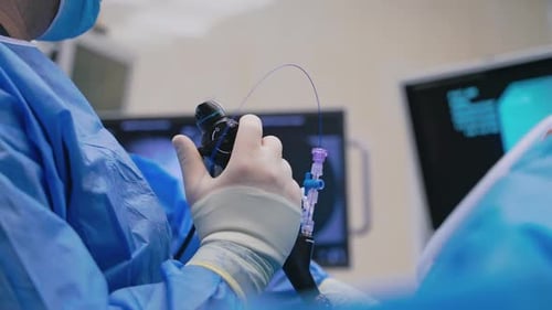 New technologies in surgery. Close-up doctor's hand with modern equipment