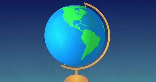 Globe spinning on stand against blue background