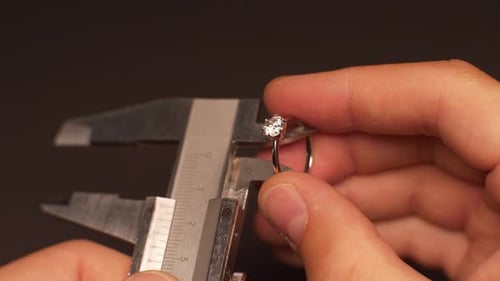 Measuring Diamond Ring with Caliper Gauge