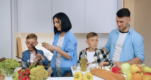 Family Cooking Together in a Bright Home Kitchen