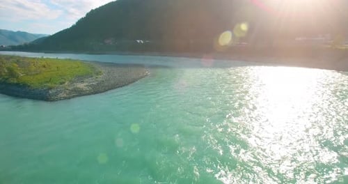 Low Altitude Flight Over Fresh Fast Mountain River with Rocks at Sunny Summer Morning