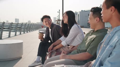 Asian Friends Talking Outdoors