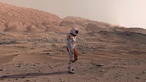 Astronaut Walking on Mars Desert Planet Landscape