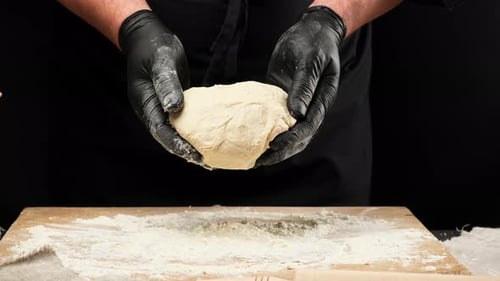 Baker Preparing Dough in Close Up Footage