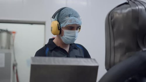 Busy Male Employee Controls Equipment At Beer Factory Medium Shot