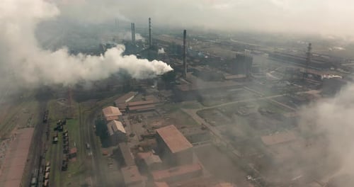 Industrial Factory Aerial View Releasing Plumes of Smoke