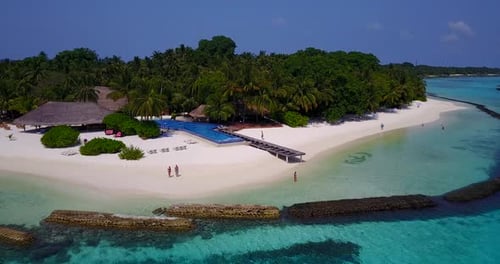 Tropical aerial tourism shot of a paradise sunny white sand beach and turquoise sea background in be