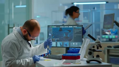 Scientist Using Pipette in Bright Modern Laboratory