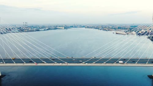 Motion Past Bridge Pylons and Cables Cars Speed Downwards