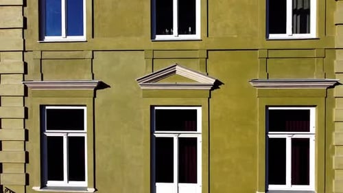 Facade of a European city building. Elements of architecture. Aerial drone view.