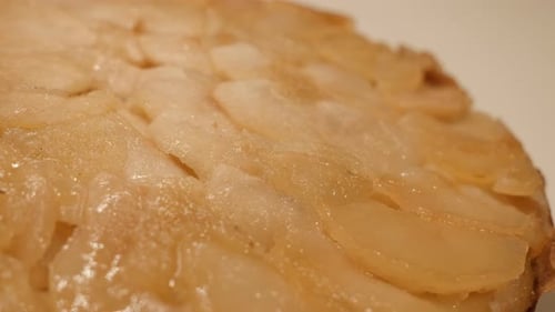 Slow tilt over served fruit cake close-up 4K 2160p 30fps UltraHD footage - Tasty apple pie in bak