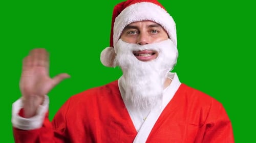 Santa Claus in Red Suit Wag Hand Palm on Green Chroma Key Background Santa Claus in Red Suit Wag Hand Palm on Green Chroma Key Background