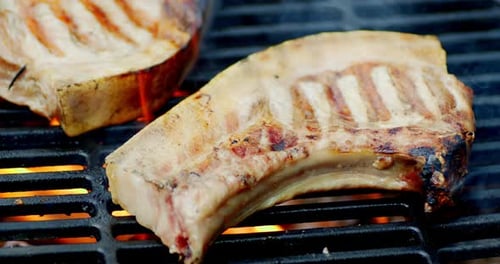 Delicious Steaks Sizzling on a Grill