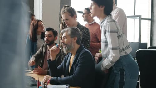 Diverse Team Collaborating on a Project in Office
