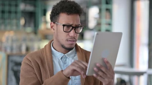 Adult Using Tablet, Disgusted and Frustrated