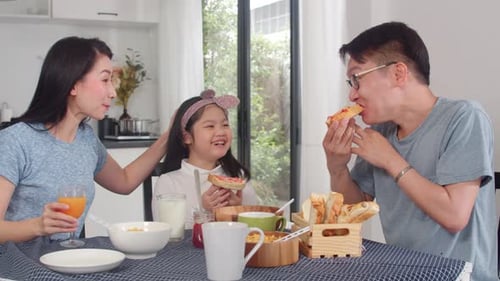 Family Enjoys Breakfast Together in Bright Kitchen