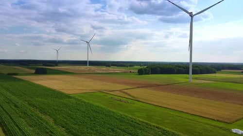 Line of Wind Energy Turbines in Summer
