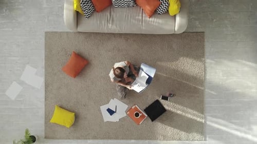 A Tired, Tense Young Woman Reads a Synopsis.