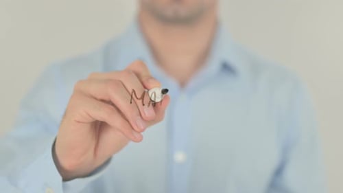 Man Writes Marketing Concept on Clear Surface