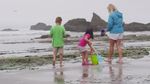 Children playing at beach. Shot on RED EPIC for high quality 4K, UHD, Ultra HD resolution.