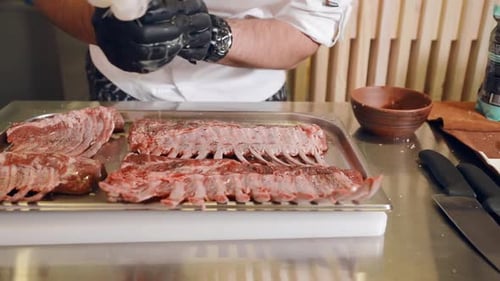 Chef Preparing Seasoned Rack of Lamb
