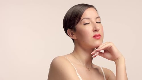 Beauty Brunette Model in Studio Alone with Ideal Shiny Skin Portrait
