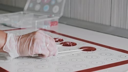 Chef Making Homemade Sugar Lollipops and Puts a Wand to Them