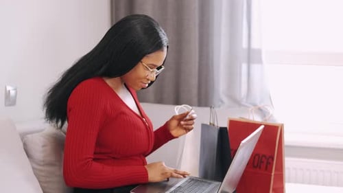 Woman Shopping Online at Home with Laptop