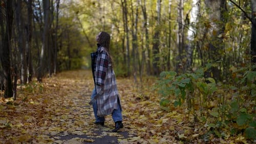 Emotional Woman is Walking Alone in Forest in Autumn Day Sad Feelings