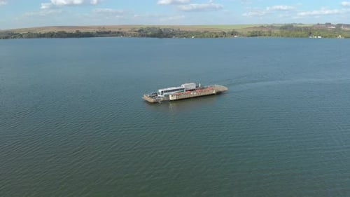 Ship crosses cars from one side of the river to the other. Transport ferry