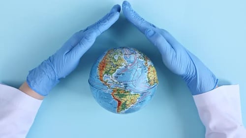 Hands Shielding Globe with Protective Gloves