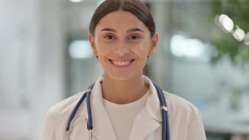 Smiling Doctor in a White Coat Close Up