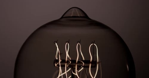 Decorative Light Bulb Illuminating in the Darkness