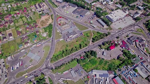 Drone Rises Above the Intersection of the Roads in a Suburb
