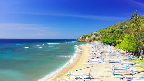 Drone Moving Forward Over the White Fisherman Boats on the Sand at Amed Beach, Surrounded By
