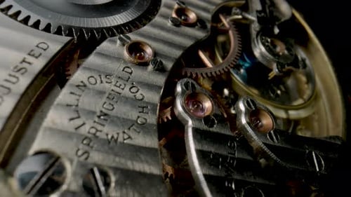 Antique Pocket Watch Mechanism Moving on Isolated Black Studio Background