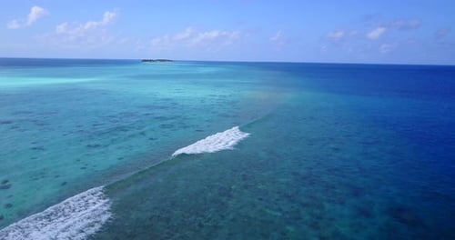Wide above abstract view of a sandy white paradise beach and aqua turquoise water background in high res