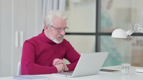 Man on Video Call at Desk