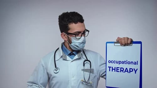 Occupational Therapist Holding a Sign in a Hospital
