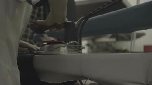 One person ironing