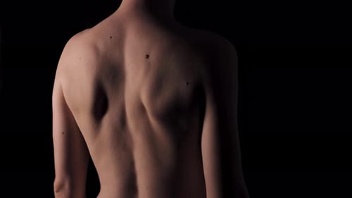 Detailed Shot of Person's Back in Studio