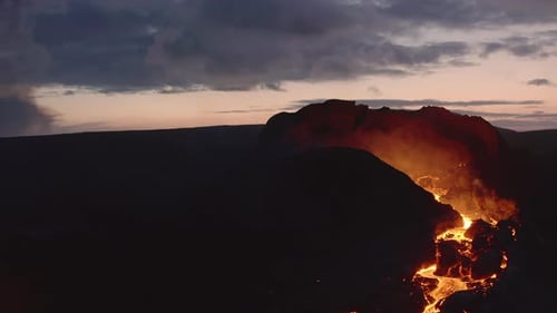 Aerial view of Volcano magma coming through a crater fume in the earth surface